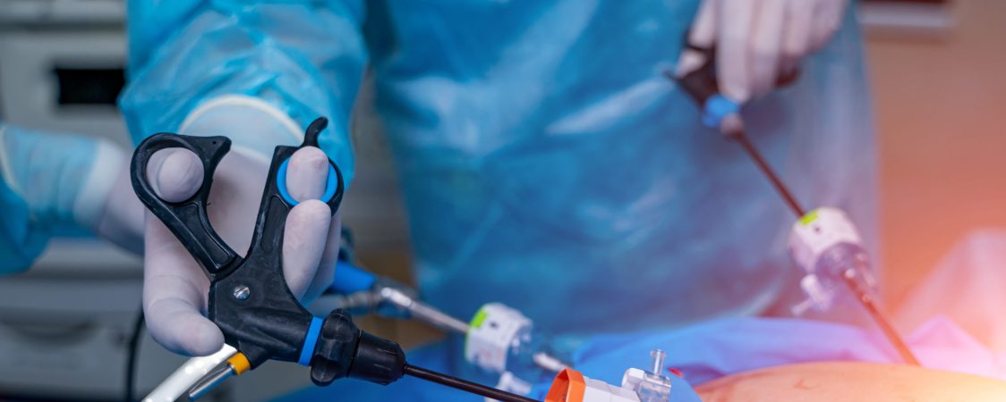 Surgery operation with modern equipment. Selective focus on doctor s hands with special robotic equipment.